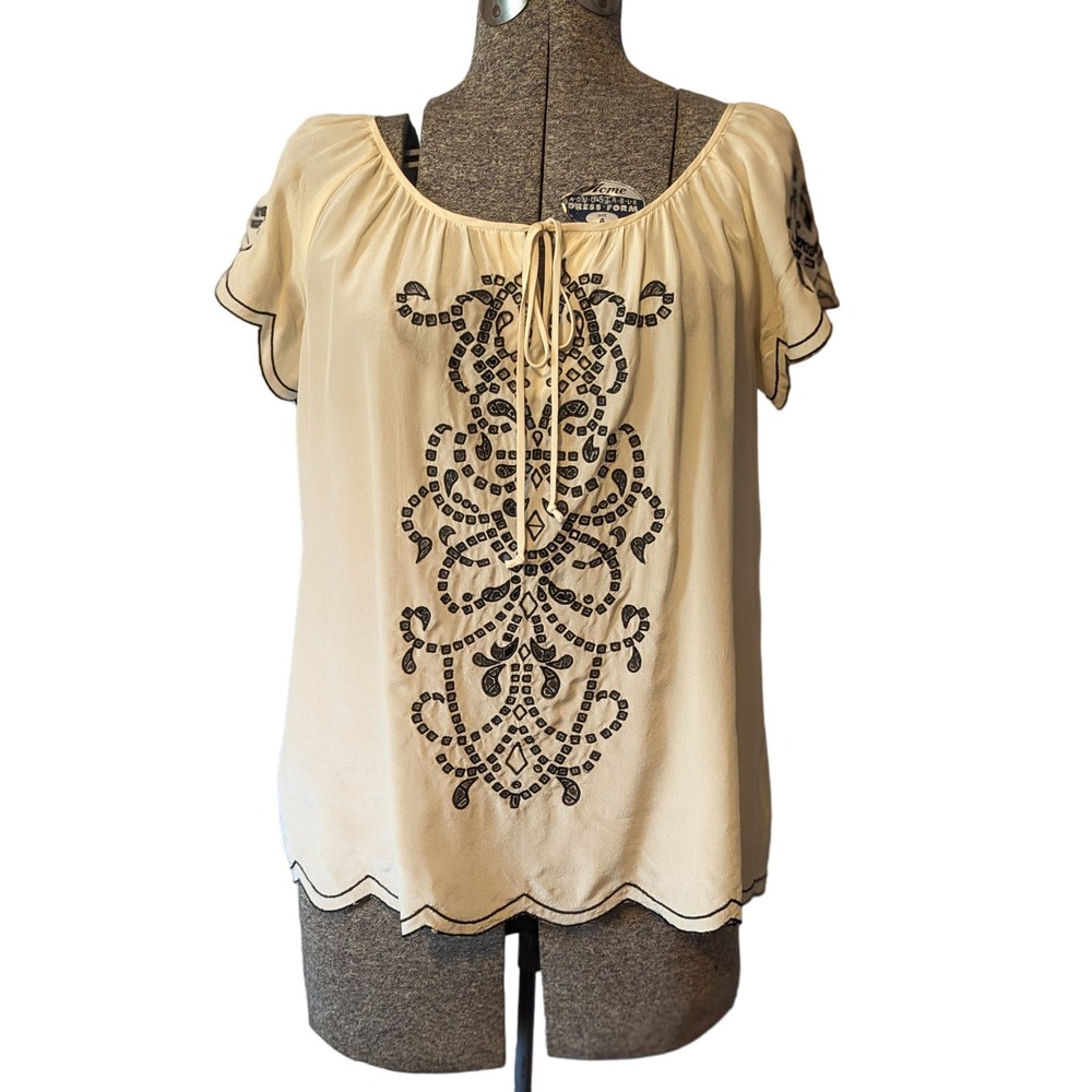 Nanette Lepore Silk Top in sz 6. Cream with black embroidery cutouts & front tie